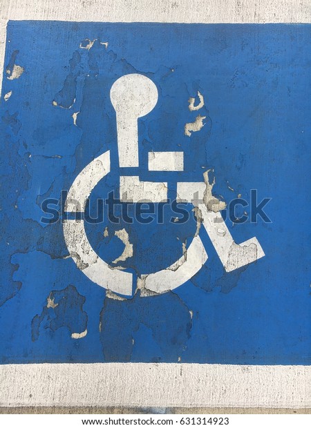 Distressed\
handicap accessible pavement sign blue\
white