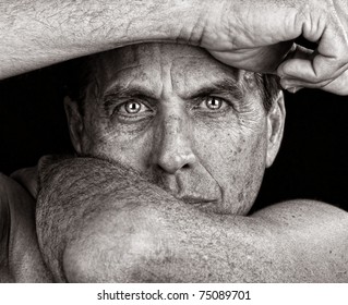 Distressed Man Framing His Face with His Arms