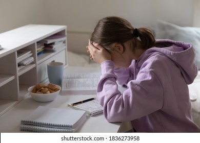 Distressed Teen 13s Girl Pupil Feel Unmotivated Studying Alone Doing Homework At Home. Upset Unhappy Teenage Child Stressed With School Task Assignment Preparation, Have Difficulties With Learning.