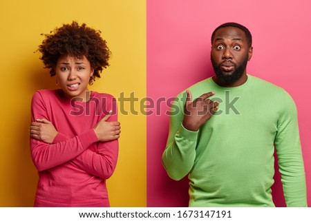 Image, Stock Photo adult man in black clothes stands upright with strained muscles