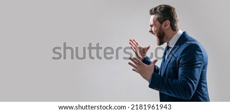 Distressful experience. Man face portrait, banner with copy space. Business man in suit, isolated studio background. Angry boss scream making wide gesture. Professional man scream in anger.