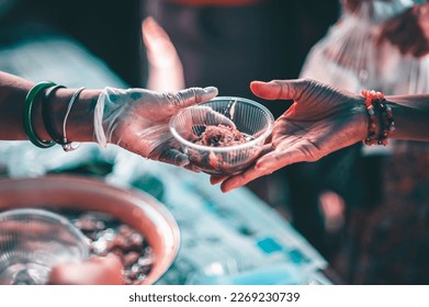 Distributing food to help the poor in society : Sharing food to the hungry : Food donation concept - Powered by Shutterstock