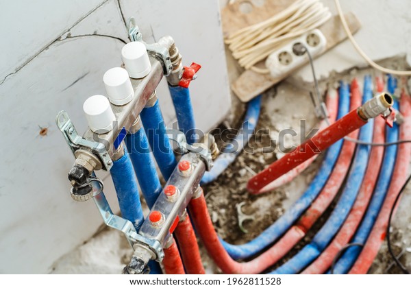 Distribution group in the central heating\
system of the house. Repair and installation of the pipeline using\
modern materials. Foreground. Selective\
focus