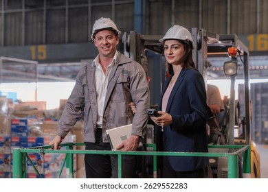 Distribution warehouse manager and client businesswoman using digital tablet checking inventory storage on shelf. Storehouse business worker and logistic engineer standing together at storage service