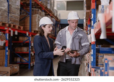 Distribution warehouse manager and client businesswoman using digital tablet checking inventory storage on shelf. Storehouse business worker and logistic engineer standing together at storage service