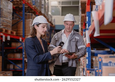 Distribution warehouse manager and client businesswoman using digital tablet checking inventory storage on shelf. Storehouse business worker and logistic engineer standing together at storage service