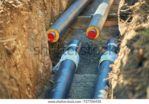 District heating - connecting insulated pipes\
District\
heating is a system for distributing heat generated in a\
centralized location for residential and commercial heating\
requirements .