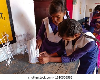 DISTRICT KATNI, INDIA - JANUARY 21, 2020: Two Indian Government School Female Students Creating Hand Craft Item For Science Project At Classroom.