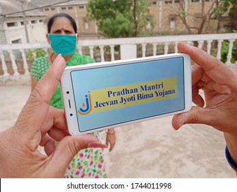 District Katni, Madhya pradesh, India - May 28, 2020: Pradhan mantri jeevan jyoti bima yojana, indian government Life Insurance scheme displayed on smart phone screen. 
