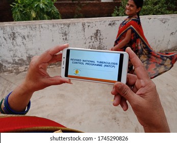 District Katni, Madhya Pradesh, India - May 28, 2020: RNTCP, Revised National Tuberculosis Control Indian Government Scheme Presented On Hand Holded Smartphone Screen.