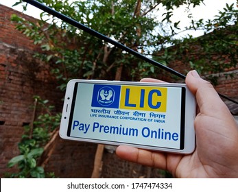 District Katni, Madhya Pradesh, India - May 28, 2020: LIC, Life Insurance Corporation Of India Symbol Displayed On Holded Hand Smart Phone Screen.