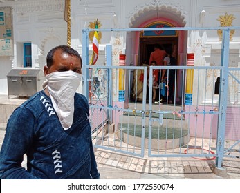 District Katni, Madhya Pradesh, India - July 08, 2020: An Indian Village Man Wearing Face Mask At Hindu Temple During Worship For Corona Virus Protection. 