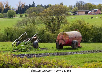 Disused Farm Trailers In A Farmers Field. Slurry Tanker And Trailer Abandoned.