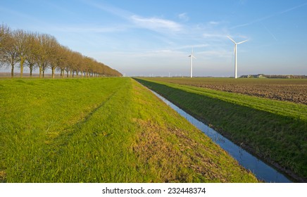 Ditch Along A Plowed Field At Sunset In Autumn