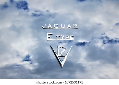 Ditchling, West Sussex, England. 07/14/16. Jaguar E type, V12 badges. 