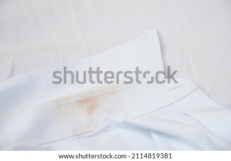 dity sweat stain on cloth from living in daily life. dirt for cleaning housework concept.
