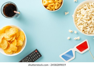 Dive into a home cinema adventure: top view of popcorn, crisps, soda, and streaming remote. Movie-themed decorations on pastel blue, ideal for text or advertising placement - Powered by Shutterstock