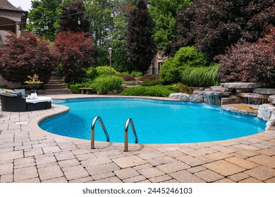 Dive into luxury with this stunning photo featuring a lavish swimming pool, exquisite house, lush green backyard, and meticulously designed garden. Experience the pinnacle of opulence and tranquility. - Powered by Shutterstock