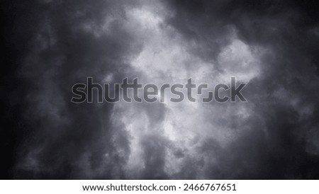 Dive into the mystery of stormy skies with this evocative image showcasing the dramatic interplay of light and shadow in thick clouds.