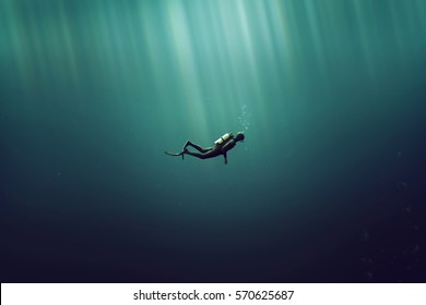 Diver In The Deep Sea