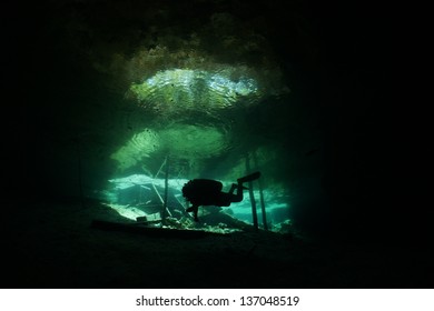 Diver at the entrance of the cavern zone at Cenote Dreamgate - Riviera Maya, Mexico