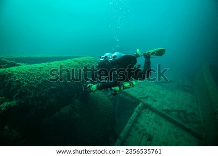 Diver exploring the shipwreck, Dolphin in the Straits of Mackinac.