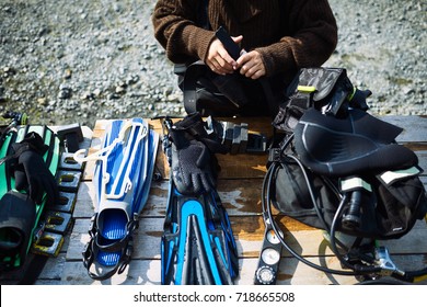 Diver Fixing Equipment On The Table 