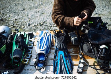 Diver Fixing Equipment On The Table 