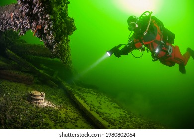 Diver On Wooden Wreck In The Baltic Ses