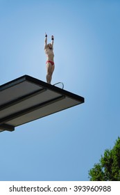 Diver Preparing To Dive From 10 Meter High Diving Platform