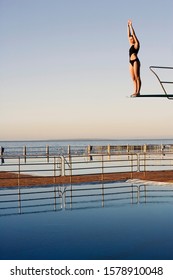 A Diver Standing On A Diving Board