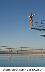 A diver standing on a diving board