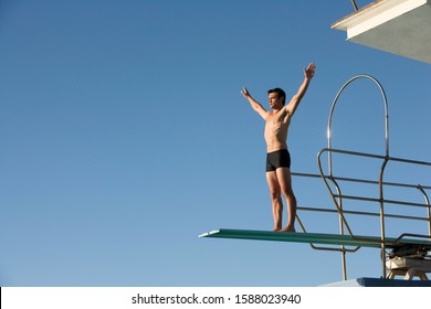 A diver standing on a diving board
