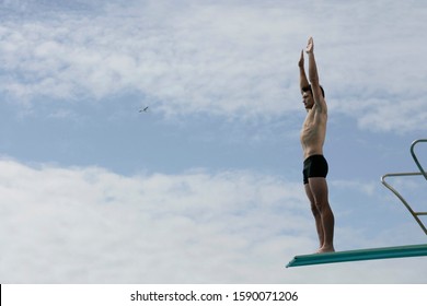 A Diver Standing On A Diving Board