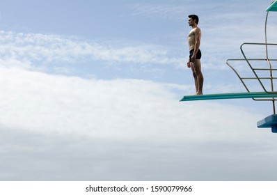 A Diver Standing On A Diving Board