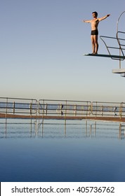 A Diver Standing On A Diving Board