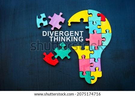 Divergent thinking sign and bulb from puzzle pieces.