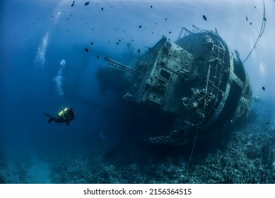 Divers exploring the shipwreck in the Jordan Red Sea - Shutterstock ID 2156364515