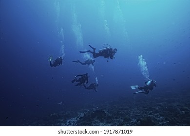 divers in the ocean, underwater sport active recreation in the deep ocean - Shutterstock ID 1917871019