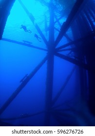 Divers On An Oil Rig In The Gulf Of Mexico