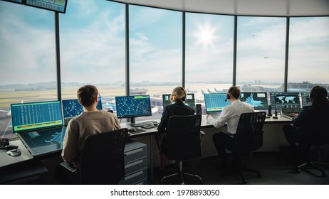 Diverse Air Traffic Control Team Working in a Modern Airport Tower. Office Room is Full of Desktop Computer Displays with Navigation Screens, Airplane Flight Radar Data for Controllers. - Shutterstock ID 1978893050