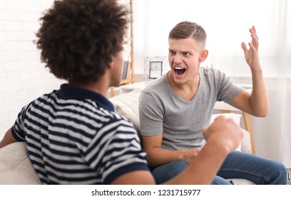 Diverse Angry Roommates Fighting And Threatening In Room At Home