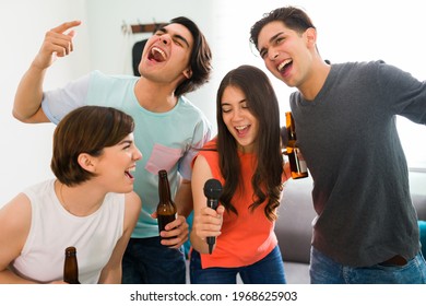 Diverse And Attractive Best Friends Celebrating The End Of The College Semester With Beer And A Karaoke Song