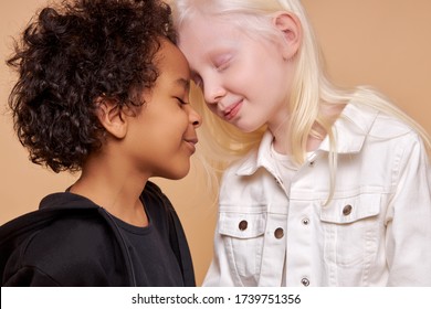 Diverse Black And Albino Kids In Love, They Have Tender Feeling For Each Other, People With Unusual Hair And Skin Color