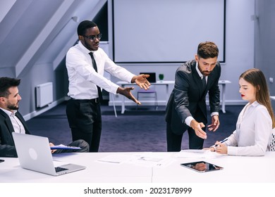 Diverse Black Employee And White Boss Arguing In Office, African Worker Disagreeing With Dismissal Firing Protecting Rights Or Behaving Rudely, Multiracial Conflict At Work And Racial Discrimination.