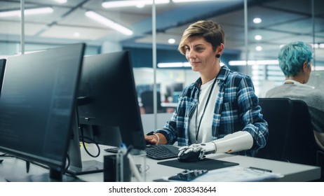 Diverse Body Positive Office: Portrait of Motivated Woman with Disability Using Prosthetic Arm to Work on Computer. Professional with Advanced Thought Controlled Body Powered Myoelectric Bionic Hand - Shutterstock ID 2083343644