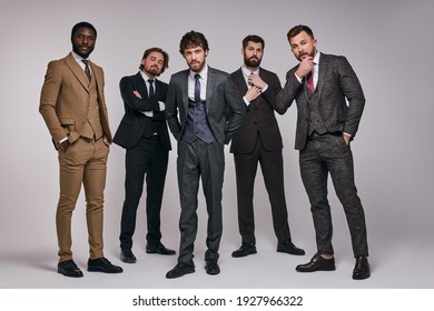 Diverse Brutal Men In Classic Suit Looking At Camera Posing, Ready To Go At Business Meeting, Male Models In Studio. Business People Concept