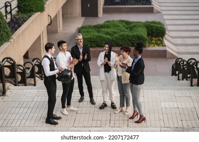 Diverse Business Group, With People Of Different Ages And Cultures. Open Air Meeting, Applause