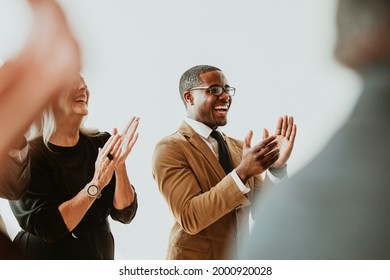 Diverse business people applauding with joy - Powered by Shutterstock