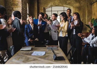 Diverse Business People Celebrating Together Inside Bank Office - Focus On Center Man Face